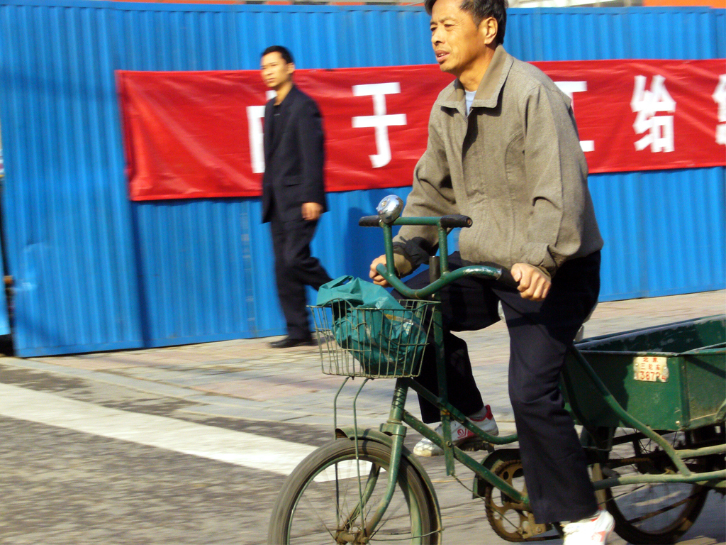 Chinese Guy on local bike